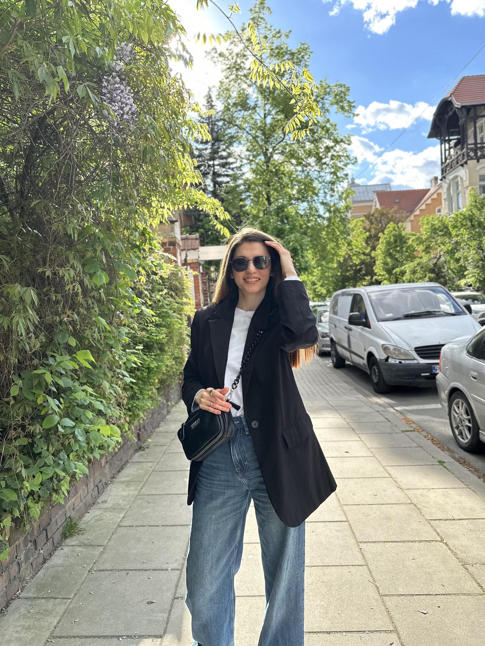 Lena in sunglasses walking outside